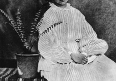 July 1860:  Alice Liddell (1852 - 1934) on whom the heroine of 'Alice's Adventures in Wonderland' (1865) by Lewis Carroll is based, sitting by a potted fern.  (Photo by Lewis Carroll/Getty Images)