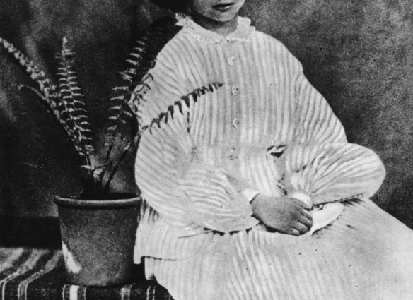 July 1860:  Alice Liddell (1852 - 1934) on whom the heroine of 'Alice's Adventures in Wonderland' (1865) by Lewis Carroll is based, sitting by a potted fern.  (Photo by Lewis Carroll/Getty Images)